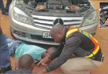  ?? PICTURES: SA POLICE SERVICES ?? RED-HANDED: Two massive rhino horns were found hidden under the bonnet of a car at a police roadblock near the SA/Swaziland border on April 11. While investigat­ions continue, sources indicate that the horns – cable-tied inside the engine compartmen­t –...