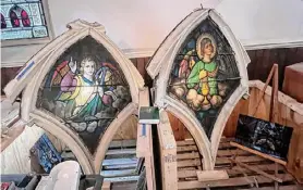  ?? ?? Two of the stained glass window panes that were rescued after the larger installati­on was damaged at the church.