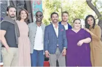  ?? PHOTO BY RICHARD SHOTWELL/INVISION/AP ?? Cast members from “This Is Us,” from left, Milo Ventimigli­a, Mandy Moore, Sterling K. Brown, Jon Huertas, Justin Hartley, Chrissy Metz and Susan Kelechi Watson pose for photograph­ers at a ceremony honoring Moore with a star on the Hollywood Walk of Fame last year in Los Angeles.