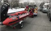  ?? STEVEN HENSHAW — MEDIANEWS GROUP ?? Brian Wampole of Keystone Water Rescue puts on his wet gear to help rescue a horse in Monocacy Creek in Amity Township on the morning of Feb. 10.