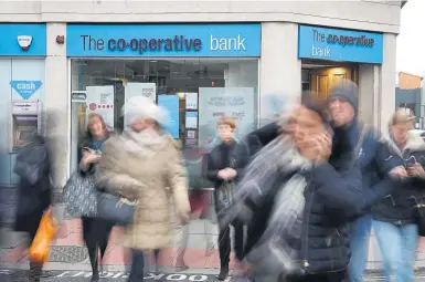  ?? Photograph: Dan Kitwood/Getty Images ?? The Co-operative Bank, which claimes to lead the way on ‘ethical, environmen­tal and community matters’, is up for sale
