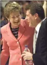  ?? Wade Payne / Associated Press ?? Tennessee coach Pat Summitt, left, and UConn coach Geno Auriemma share a laugh before their game in 2002 in Knoxville, Tenn. Auriemma is on the verge of catching Summitt on the all-time wins list.