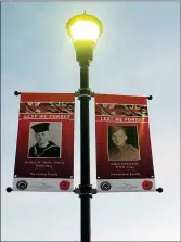  ?? ?? The banners of Wally Shirley and Eldon Stewardson are installed in Memorial Park.