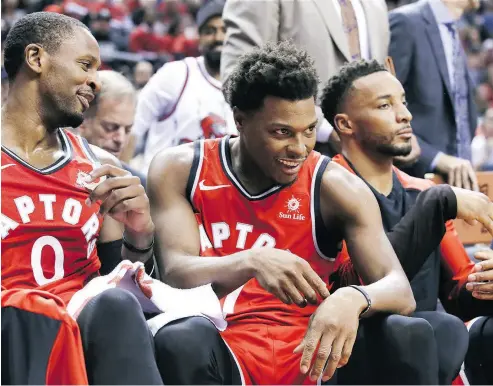  ?? VERONICA HENRI / POSTMEDIA NEWS ?? Toronto Raptors guard Kyle Lowry, centre, quietly showcased his skills in a 116-104 opening night win on Wednesday.