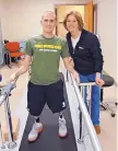  ??  ?? Justin Crabbe, seen here with his mother, Maureen, underwent rehabilita­tion at Walter Reed National Military Medical Center in Maryland.