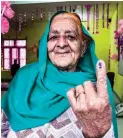  ?? ?? JUST VOTED – A woman shows the indelible ink mark on her finger after casting vote during the first round of polling of India’s national election in Doda district, Jammu and Kashmir, India, Friday, April 19, 2024. (AP)