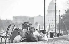  ?? JIM LO SCALZO/EPA ?? Trash lies uncollecte­d on the National Mall in Washington during the shutdown, now the second-longest in history.