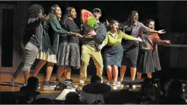  ??  ?? Cast members perform together during a dress rehearsal of “Little Shop of Horrors” at Pottstown High School.