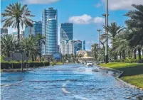  ?? ?? A flooded street following heavy rains in Sharjah. Torrential rain caused floods across the UAE and Bahrain. Picture: AFP