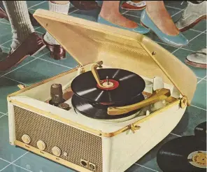 ??  ?? A portable record player in the 1950s. Vinyl dominated music sales until 1988