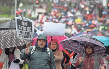  ?? ROBERT HANASHIRO/USA TODAY ?? Thousands of teachers and supporters march in downtown Los Angeles on the offices of the Unified School District, the nation’s second-largest. About 34,000 teachers walked off the job.