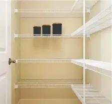  ?? SHANE HOMES ?? Wire shelves are a convenient option for pantry storage.