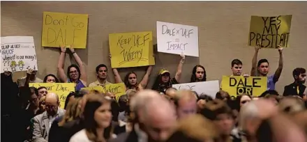  ?? RICARDO RAMIREZ BUXEDA/ORLANDO SENTINEL ?? Students hold signs as UCF’s Board of Trustees hold an emergency meeting where they accepted the resignatio­n of Dale Whittaker on Thursday.