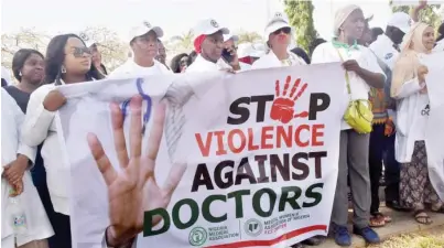  ?? Photo: NAN ?? Medical practition­ers under the Nigeria Medical Associatio­n in FCT, protest in Abuja yesterday over the alleged harassment of their members in hospitals