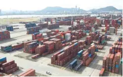  ??  ?? Shipping containers are seen at Dachan Bay Terminals in Guangdong, China. — Reuters