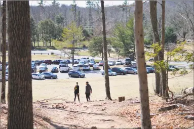  ?? Clare Dignan / Hearst Connecticu­t Media file photo ?? Visitors walk at Sleeping Giant State Park in Hamden in March. Firefighte­rs and other first responders report an increase in emergency calls for outdoor rescues this year.