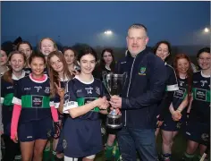  ??  ?? Wicklow Camogie Chairman Ivor Lehane presents Bray Emmets captain Emma Nesbitt with the camogie Féile under-14 cup.