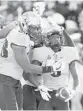  ?? JOSE LUIS MAGANA/AP ?? UCF’s Adrian Killins, right, celebrates a 15-yard touchdown run Saturday with teammates.