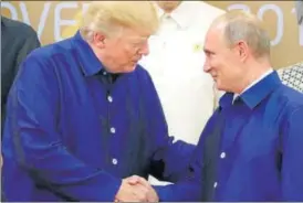  ?? REUTERS FILE ?? Donald Trump and Vladimir Putin at the APEC summit in 2017.
