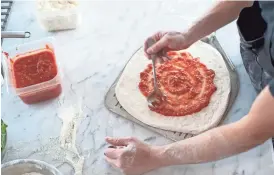  ?? CAMERON CLARK ?? Dough for the crust at Pizziclett­a in Flagstaff is naturally leavened using a sourdough starter that is fermented for three days.