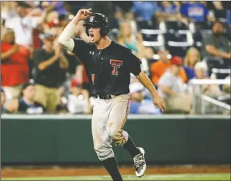  ?? The Associated Press ?? GATORS CHOMPED: Texas Tech’s Cody Farhat celebrates Sunday after scoring against Florida on a base hit by Gabe Holt in the ninth inning of their College World Series game in Omaha, Neb. The Red Raiders won, 6-3.