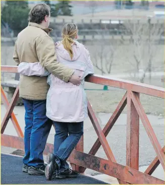  ?? Ed Kaiser, Edmonton Journal ?? This couple, who cannot be identified, had their child taken by the Alberta government about a month ago and are worried about his welfare. They are unable to get informatio­n from government agencies.