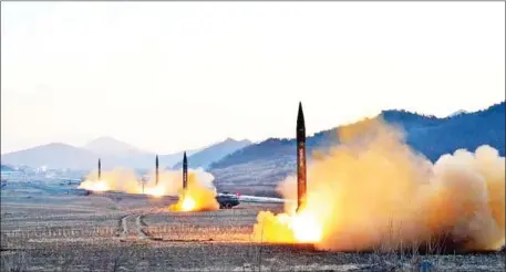  ?? KCNA VIA KNS/AFP ?? This undated picture released by North Korea’s Korean Central News Agency via KNS on March 7 shows the launch of four ballistic missiles by the Korean People’s Army during a military drill at an undisclose­d location in North Korea.