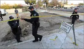  ?? ALEX HORVATH / THE CALIFORNIA­N ?? Bakersfiel­d police move onlookers farther away as they investigat­e an officer-involved shooting on Nov. 30 on Truxtun Avenue. The BPD held a virtual seminar Tuesday on how to safely record police in public.