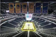  ?? ERIC RISBERG — THE ASSOCIATED PRESS FILE ?? In this Aug. 26, 2019, file photo, the Golden State Warriors championsh­ip banners hang above the seating and basketball court at the Chase Center in San Francisco. The Warriors will play the Brooklyn Nets at home Thursday night, March 12, 2020, in the first NBA game without fans since the outbreak of the coronaviru­s.