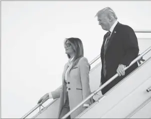  ?? AP PHOTO ?? U.S. President Donald Trump and first lady Melania Trump arrive at the airport in Helsinki, Finland, Sunday on the eve of his meeting with Russian President Vladimir Putin.