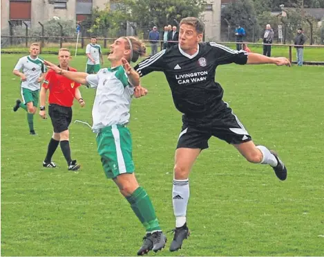  ??  ?? Thornton Hibs’ Garry Thomson is challenged by Livingston United’s Callum Williamson.