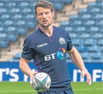  ?? Pictures: SNS. ?? Captain Greig Laidlaw, top left, at yesterday’s captain’s run at BT Murrayfiel­d alongside Finn Russell, top right with assistant coach Danny Wilson, who wears the dark blue for the first time since the Six Nations; and former Howe player Peter Horne.