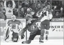  ?? NATHAN DENETTE, THE CANADIAN PRESS ?? Canada’s Drake Batherson celebrates one of his three goals Thursday night.