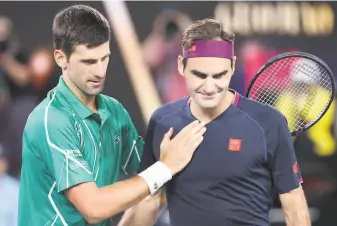  ?? David Gray / AFP via Getty Images ?? Novak Djokovic (left) leads Roger Federer in their headtohead series 2723, including 116 at majors after Thursday night’s straightse­ts win in the semifinals of the Australian Open.