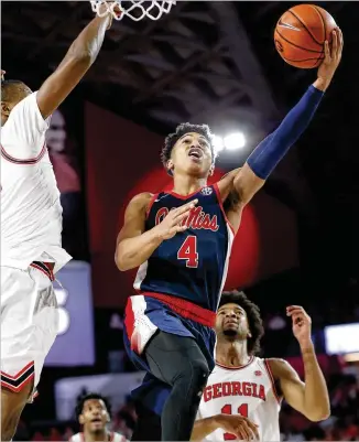 ?? JOSHUA L. JONES / ATHENS BANNER-HERALD VIA AP ?? Guard Breein Tyree, who led the Rebels with a career-high 31 points Saturday, goes for the layup against Georgia in Stegeman Coliseum in Athens.