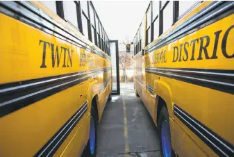  ?? Photos by Austin Steele / Special to the Chronicle 2017 ?? Electric school buses are charged in Sacramento. They require several hours for a full charge.