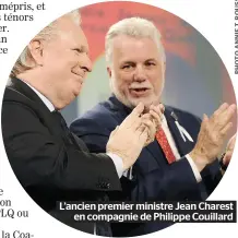  ??  ?? L’ancien premier ministre Jean Charest en compagnie de Philippe Couillard