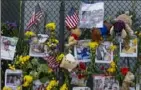  ?? Al Diaz/Miami Herald via AP ?? Momentos and flowers are seen displayed at the Surfside Wall of Hope & Memorial on July 7 for those who died during the collapse of the Champlain Towers South in Surfside, Fla.