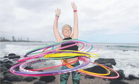  ?? Picture: RICHARD GOSLING ?? Deanne Love quit being a primary school teacher to become a full-time hula hoop instructor.