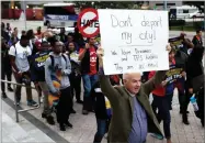  ?? AP PHOTO BY LYNNE SLADKY ?? Frank Corbishley, of Coral Gables, Fla., marches in support of Deferred Action for Childhood Arrivals (DACA) and Temporary Protected Status (TPS) programs Wednesday, in Miami.