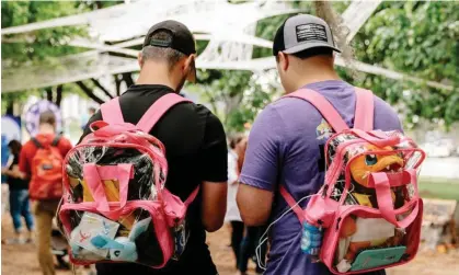  ?? ?? The men were engaged in a round Pokémon Go outside an adjacent Veterans of Foreign Wars post. Photograph: Lucy Hewett/The Guardian