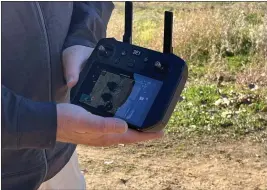  ?? ?? Advexure employee Doug Wiedman shows off the remote control for his company’s drone Wednesday at Precision Ag Day at the Chico State University Farm in Chico.