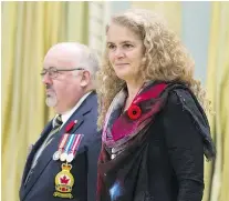  ?? — THE CANADIAN PRESS FILES ?? Governor General Julie Payette, seen last month receiving the first poppy of the national poppy campaign, criticized people who question climate change at an Ottawa policy convention Wednesday night.