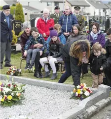  ?? Pic: Donal Hackett. ?? Pte Armstrong’s daughter Shannon lays flowers at his grave at the ceremony in Sligo Cemetery.