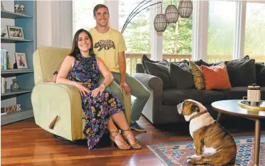  ?? KRISTOPHER SKINNER/STAFF ?? Mark Lukach and his wife, Giulia, relaxing at home in Lafayette under the adoring attentions of their dog, Goose, pooled their individual memories of their past to help him write his “My Lovely Wife in the Psych Ward” memoir.