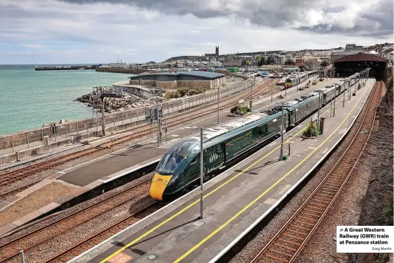  ?? Greg Martin ?? > A Great Western Railway (GWR) train at Penzance station