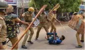  ?? — PTI ?? Police personnel lathicharg­e a protester demanding the closure of Vedanta’s Sterlite Copper unit in Tuticorin on Wednesday.