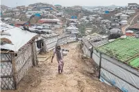  ??  ?? The Kutupalong camp complex is home to about 700,000 people, most of them living in flimsy shelters in danger of being washed away by heavy rains.