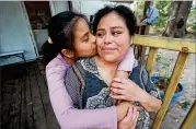  ??  ?? Vilma Carrillo, a Guatemalan in Vidalia seeking U.S. asylum, and daughter Yeisvi, 12, have been reunited after months of separation. They live in a trailer park with family in Toombs County, which went for Trump in the 2016 election but is also home to many immigrants.