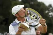  ?? MEL EVANS — THE ASSOCIATED PRESS ?? Bryson DeChambeau kisses the trophy after winning the Northern Trust golf tournament, Sunday in Paramus, N.J.